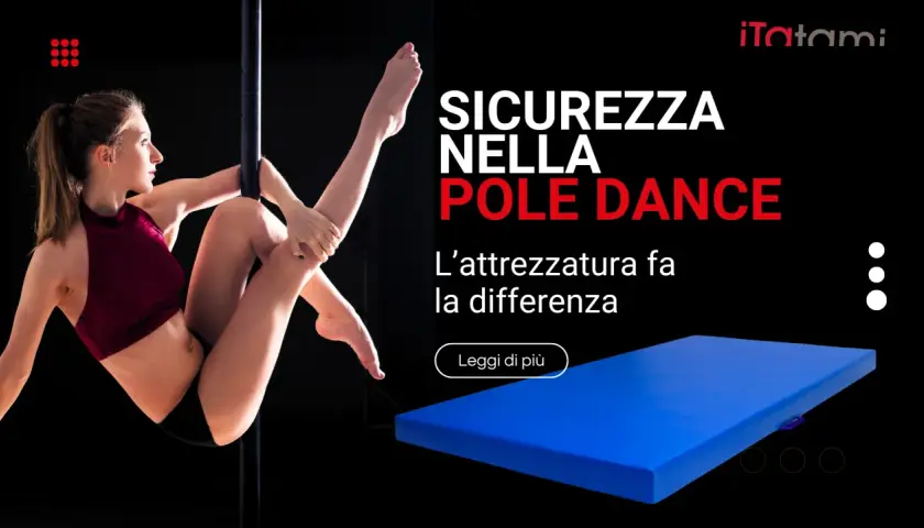 Donna esegue una figura di **danza al palo** con un tappetone blu per sicurezza.